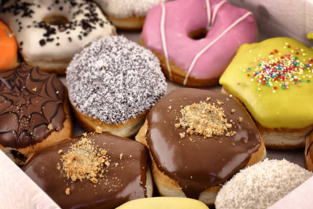 istock Bright and colorful donuts close-up in a box 849480036