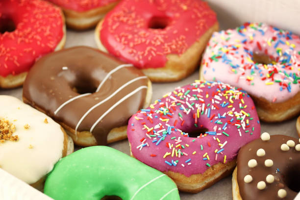 istock Bright and colorful donuts close-up in a box 849482534