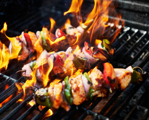 istock grilling chicken kabobs on flaming grill 849482700