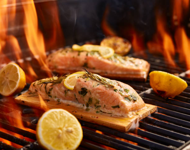 istock cedar plank salmon with lemon and rosemary on grill 849482720