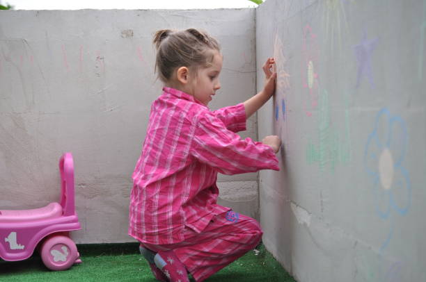 istock Little Girl Playing Drawing 849482794