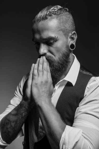 A middle-aged man is staring at something and thinking