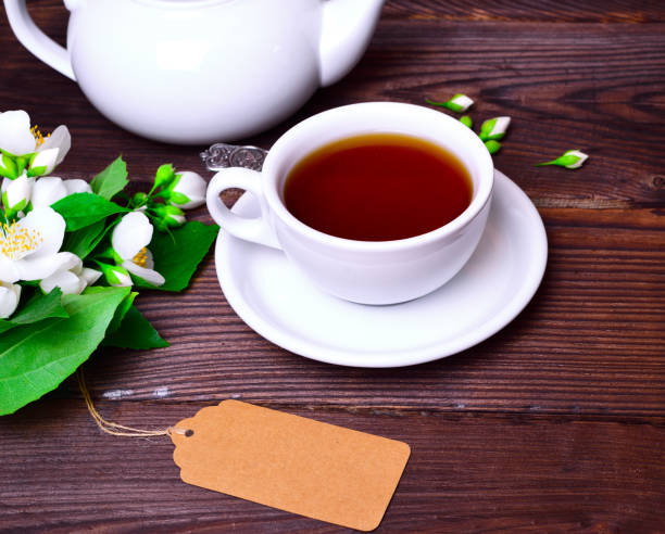 istock black tea in a white cup with a saucer 849496886