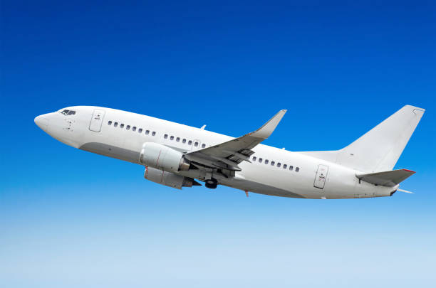 istock Passenger airplane flies in the sky gaining height above the clouds 849500184