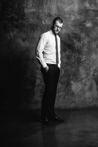 istock young man in glasses standing in white shirt 849507014
