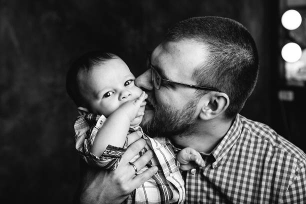 istock father kissing his baby boy 849507720