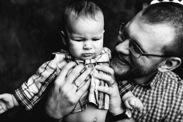 istock young father laughing holding baby boy 849507860