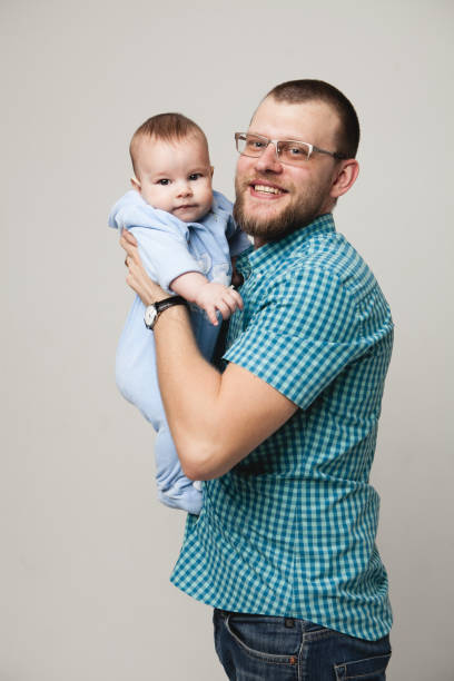 istock happy father holding his little son 849510140