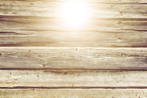 The old wood texture with natural patterns and cracks on the surface as background. Vintage tone