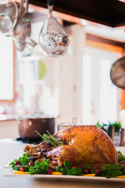 istock Thanksgiving Roast Turkey garnish and platter on rustic wooden table 849513996