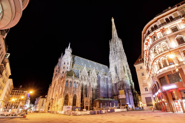 istock Low angle view of illuminated Saint Stephen's Cathedral during night at Vienna, Austria 849520962