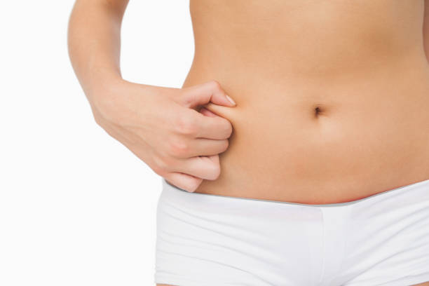 istock Slim woman with little fat on her belly 849521018