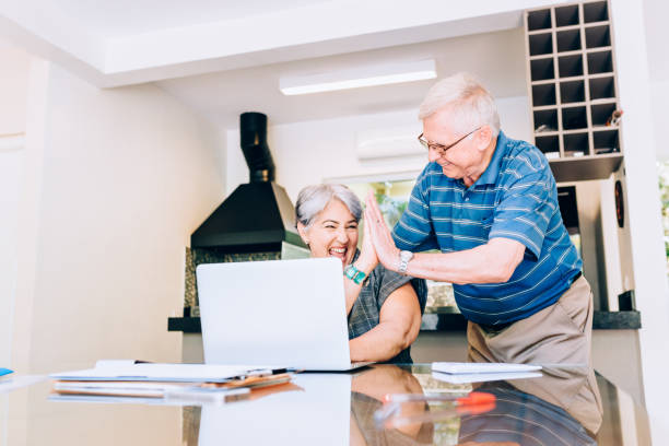 istock Senior couple surfing the web and cheering 849521862
