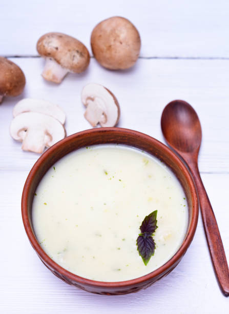 istock mushroom cream soup in a brown round plate 849525038