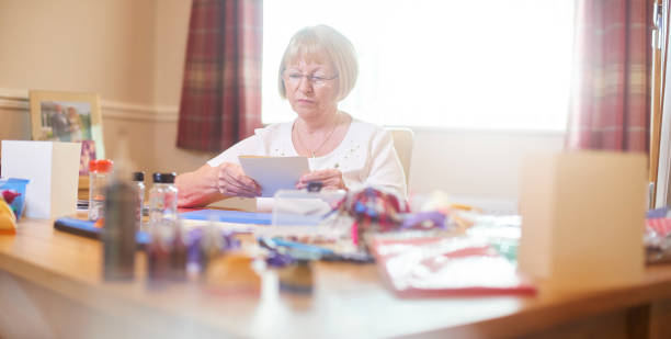 Senior woman greeting card hobby time