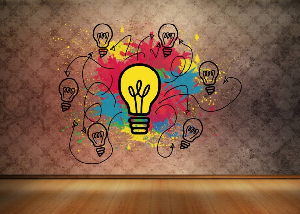 istock Colourful light bulbs graphic in empty brown room 849533338