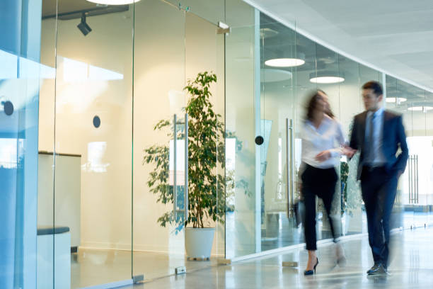 istock Blurred motion of talking colleagues 849539386