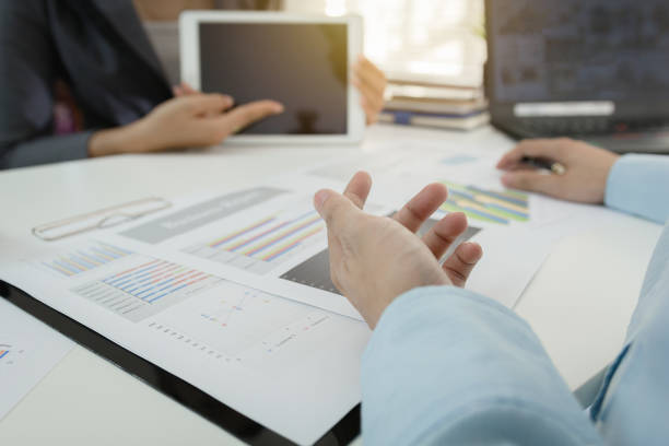 istock Investor executive discussing plan financial graph data on office table with laptop and tablet, finance, accounting, investment, meeting. 849540176