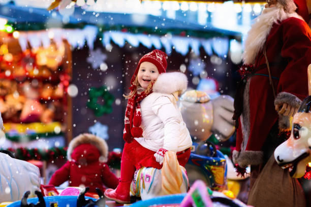 istock Child on Christmas fair. Kid riding Xmas carousel 849540326