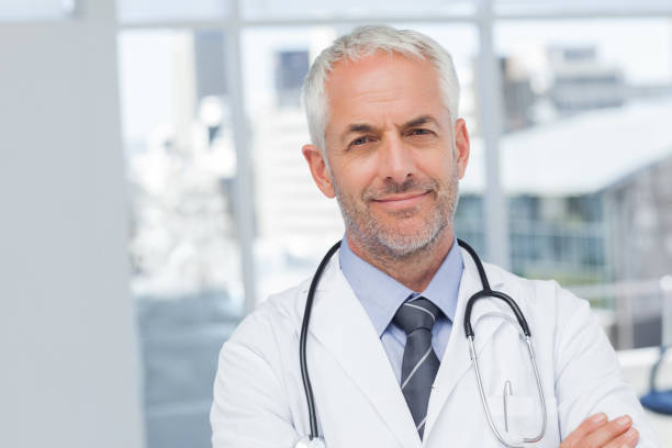 istock Serious doctor with arms crossed 849551274