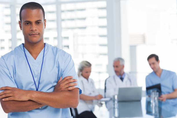 istock Serious doctor with arms crossed 849554518