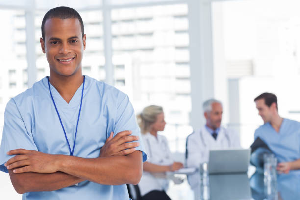 istock Smiling doctor with arms crossed 849554546