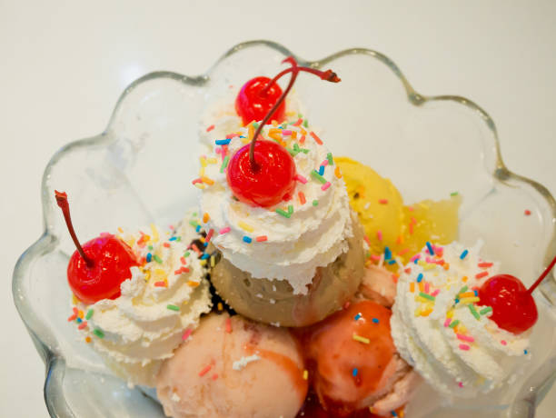 istock Ice cream scoops with whipped cream and cherry 849558314