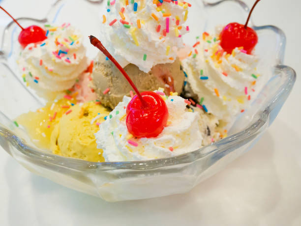 istock Ice cream scoops with whipped cream and cherry 849558316