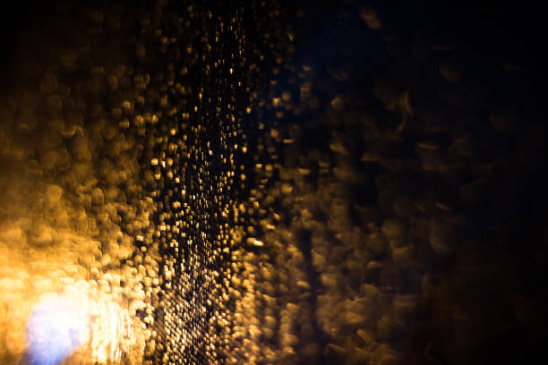 istock Abstract blur background of gold lighting during raining 849559140