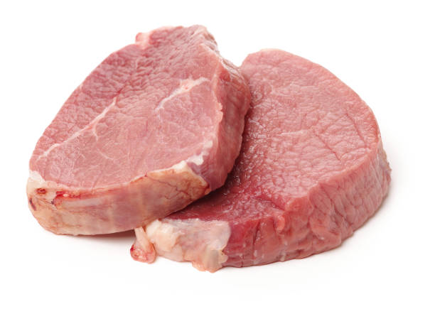 istock Two Raw Steaks isolated  on the white background 849574584