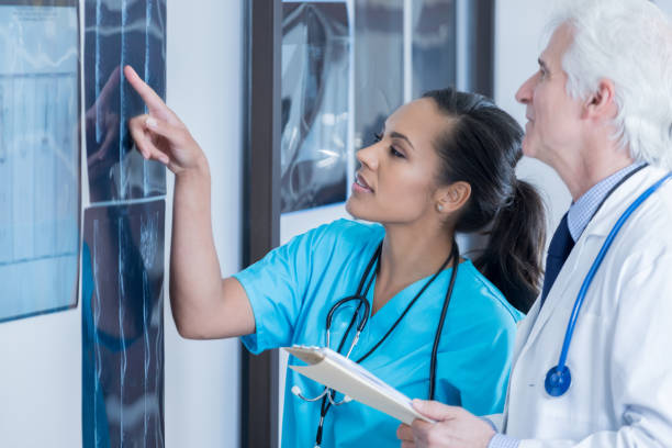 istock Two diverse radiologists review x-ray images 849578506