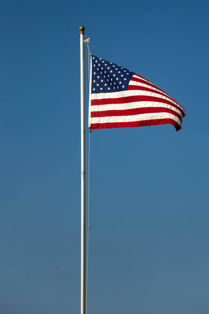 istock American flag on the blue sky 849583084