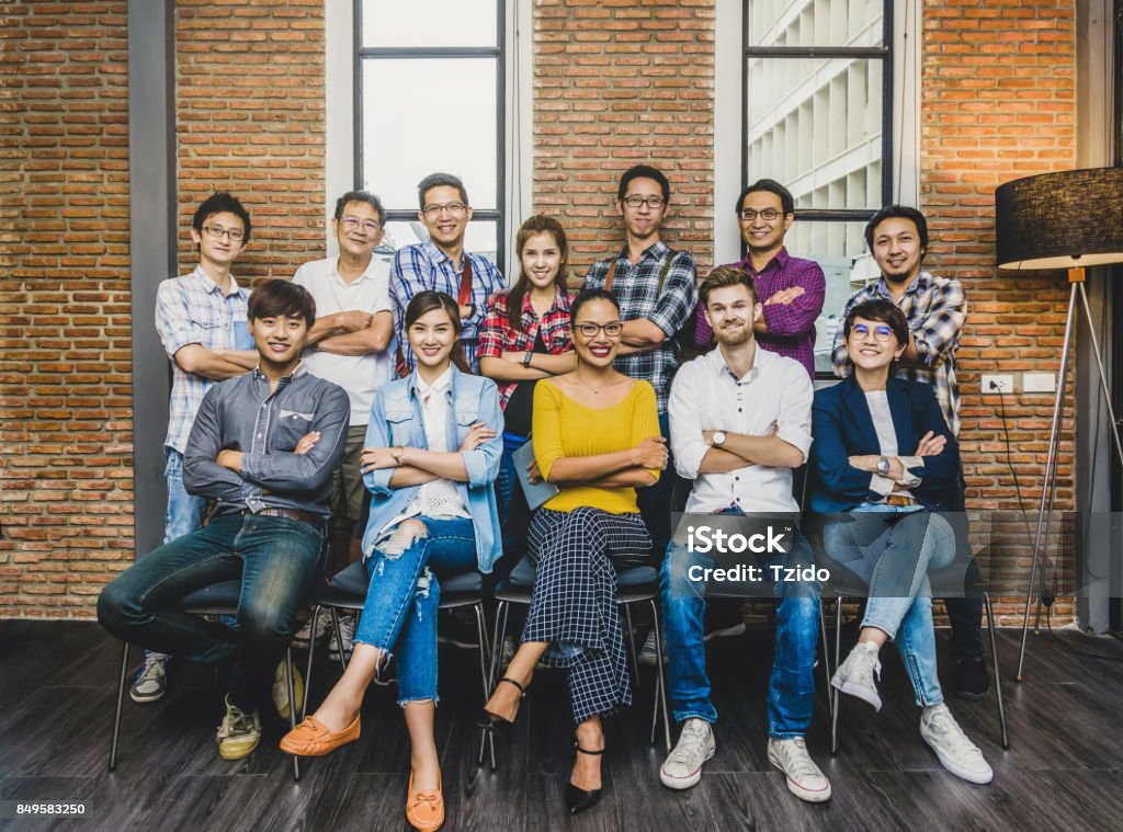 Group Of Asian and Multiethnic Business people with casual suit working in the modern Office, people business group concept Non-Profit Organization Stock Photo
