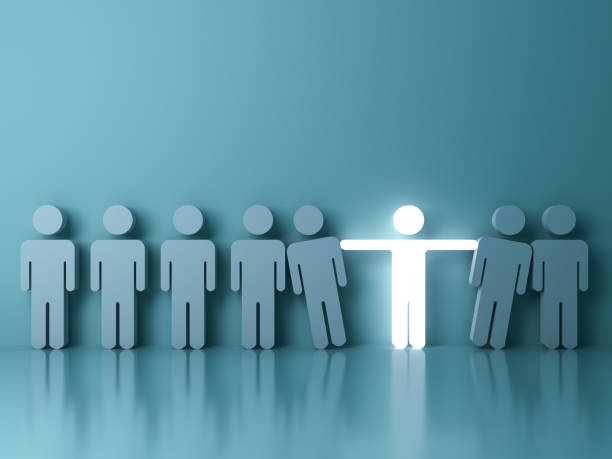 istock Stand out from the crowd and different creative idea concepts , One glowing light man standing with arms wide open among other people on green background with reflections and shadows . 3D rendering 849586860