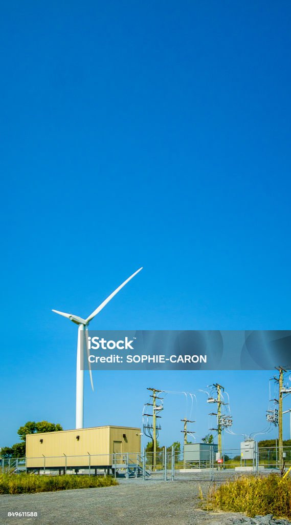 Wind turbine and sub-sectioning station Wind farm shut-off station Blue Stock Photo