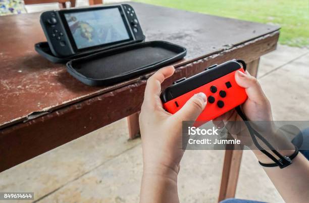 Editorial Of Close Up Kid Hold Joystick Playing Game Stock Photo - Download Image Now