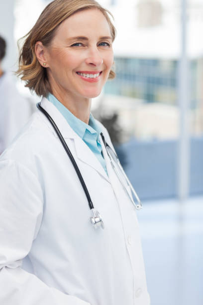 istock Smiling woman doctor with a stethoscope 849614716