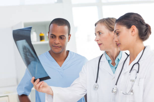 istock Medical team examining an xray 849615058