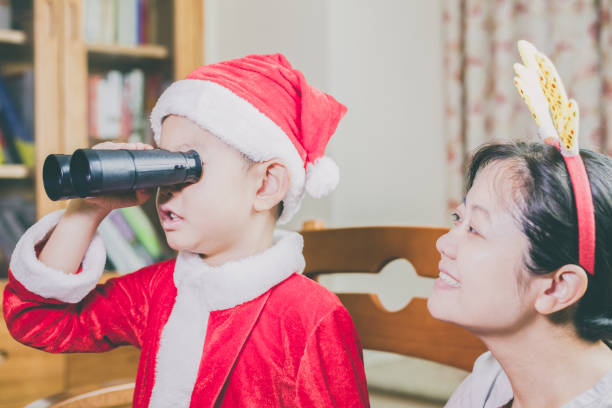 istock Mother and son playing in Christmas celebration 849618572