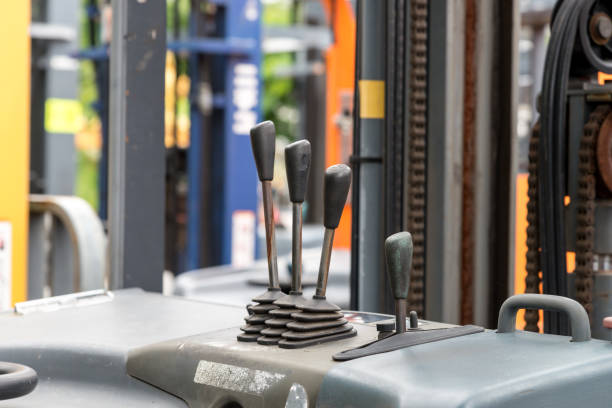 istock Focus to levers wheel control in cabin forklift truck 849623986