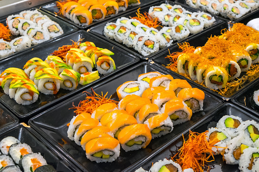 Great variety of sushi rolls at a buffet