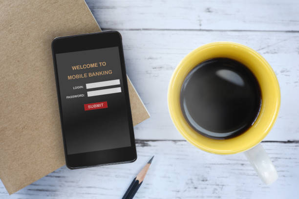 istock Mobile banking on smartphone with cup of coffee on table 849637106