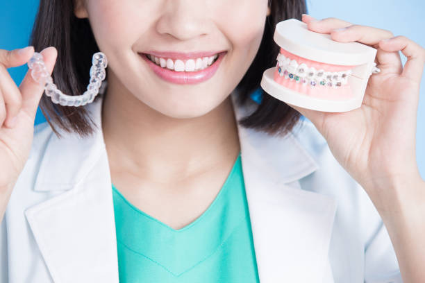 istock woman dentist take brace 849645070