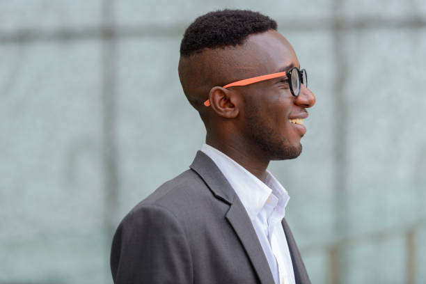 Portrait Of Young African Businessman Wearing Suit Outside The Building At  Bangkok Thailand Stock Photo - Download Image Now - iStock