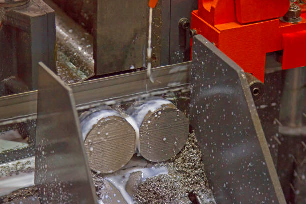 istock Hacksaw machine on cutting for round steel coolant in motion 849649558