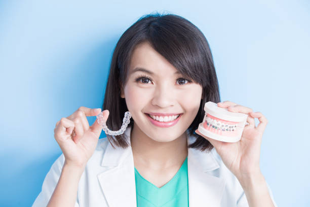 istock woman dentist take brace 849657434
