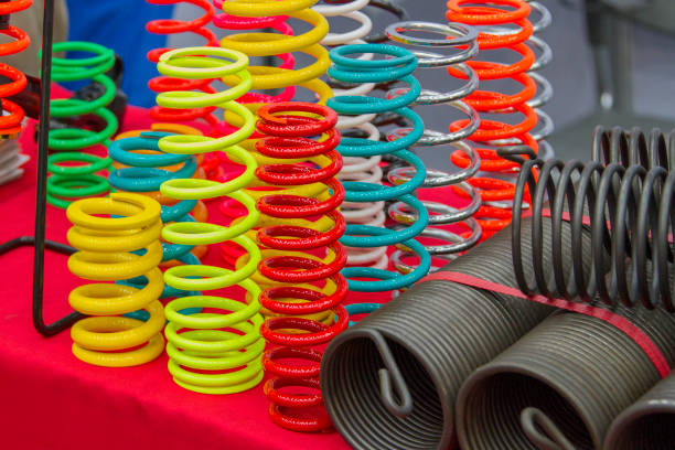 istock Coil springs are many colors on the red table. 849659934