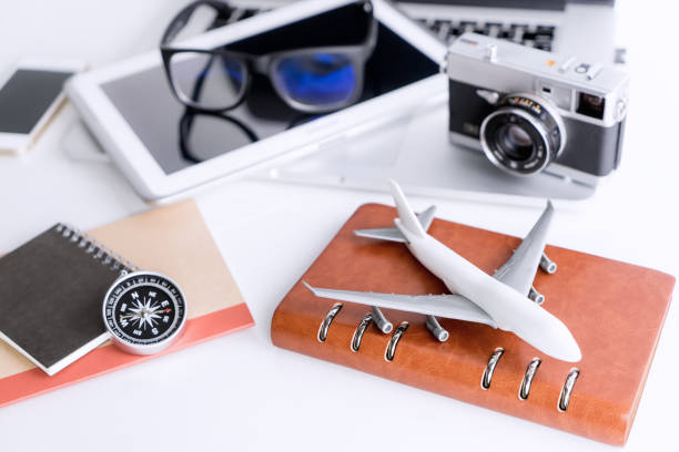 istock Air Travel vacation object on white table 849663706
