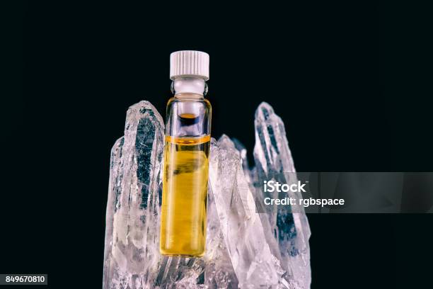 Detail Of Cannabis Oil Container And Quartz Crystal Isolated On Black Stock Photo - Download Image Now