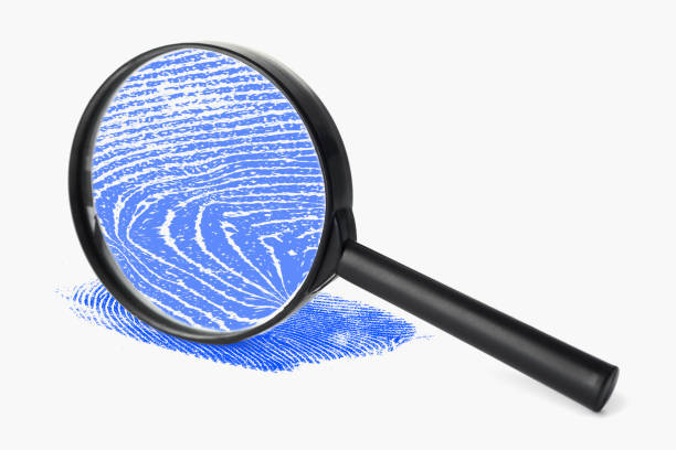 istock Magnifying glass with blue fingerprint 849672720